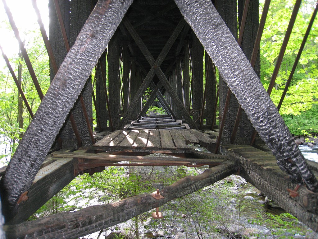 Tilton NH Rail Trail 2010 0245.jpg - Winnipesaukee River Trail, Franklin New HampshireTrestle View ParkInterested in taking a walk or bike ride on a scenic historic trail close to the downtowns of the twin rivers area, yet with the feel of wilderness. A 3 mile trail parallels the Winnipesauke river and passes the historic Sulphite upside down covered bridge believed to be the only one in the country and listed on the national register of historic places. You will also view mill ruins and remaining portions of dams that tell the history of the 5 mills that operated on this river in the mid 19th century.